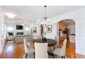 Bright living room with hardwood floors, fireplace, and seamless flow to dining and kitchen areas at 3330 Madison St, Atlanta, GA 30337