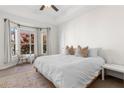 Bright and airy bedroom with a king-size bed and bay windows at 375 Highland Ne Ave # 908, Atlanta, GA 30312