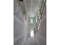 Interior view of staircase with temporary wood rails and unfinished walls at 1664 Crestridge Se Dr, Marietta, GA 30067