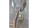 Elegant staircase featuring wood treads, iron balusters and natural light at 1664 Crestridge Se Dr, Marietta, GA 30067