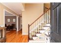 Hardwood floors, staircase, and view into living room at 1111 Valley Ridge Se Ct, Marietta, GA 30067