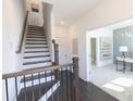 Elegant staircase with dark wood and metal railing at 522 Healy Dr # 66, Cumming, GA 30040