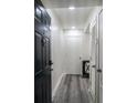 Bright entryway with dark door, gray flooring, and access to other rooms at 1280 W Peachtree Nw St # 914, Atlanta, GA 30309