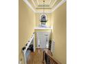 Bright foyer with high ceilings, hardwood floors, and an elegant chandelier for a grand entrance at 3423 Mulberry Lane Ct, Dacula, GA 30019