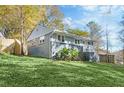 Charming single-story home boasts a well-maintained lawn and inviting front entrance with gray accents at 2190 Lang Sw Dr, Atlanta, GA 30315