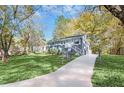 Charming single-story home with a long driveway and a well-maintained lawn and an inviting front entrance at 2190 Lang Sw Dr, Atlanta, GA 30315