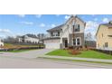 Attractive home with a well-kept lawn, two car garage, and stylish exterior at 4790 Briscoe Dr, Cumming, GA 30028