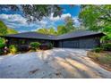 Charming home featuring a well-manicured lawn and a spacious driveway, ideal for Gathering and guests at 110 Cove Ln, Social Circle, GA 30025