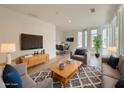 Comfortable living room with modern furnishings, a patterned rug, and lots of natural light at 290 2Nd St, Fayetteville, GA 30214