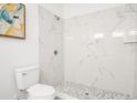 Modern bathroom with a marble shower and updated fixtures at 2048 Chicago Nw Ave, Atlanta, GA 30314