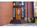 Inviting front entrance featuring a wood door with glass oval insert and stone accents, offering curb appeal and charm at 4771 Cool Springs Rd, Winston, GA 30187
