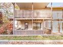 Back deck with covered patio and wooden railings at 1302 Woodcliff Dr, Atlanta, GA 30350