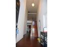 Bright entryway with hardwood floors and staircase leading to upper level at 1211 Liverpool Pointe, Lawrenceville, GA 30046