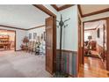 Bright hallway with coat rack and hardwood floors at 9123 Thornton Blvd, Jonesboro, GA 30236