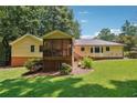 Ranch house with screened porch and landscaped yard at 9123 Thornton Blvd, Jonesboro, GA 30236