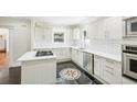 Modern kitchen featuring white cabinets, quartz countertops, and a center island at 952 Lindbergh Ne Dr, Atlanta, GA 30324