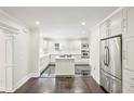 Bright, renovated kitchen with stainless appliances, a central island, and sleek black floors for modern appeal at 952 Lindbergh Ne Dr, Atlanta, GA 30324