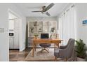 Well-lit home office with built-in shelving and comfortable furnishings at 4880 Twin Lakes Trl # 11, Atlanta, GA 30360