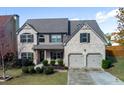 Charming two-story home with well-manicured lawn and two-car garage at 108 Laurel Bay Se Dr, Loganville, GA 30052