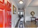 Welcoming foyer with hardwood floors, white wainscoting and a view to the living room at 7214 Gladstone Cir, Stonecrest, GA 30038
