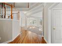 Bright entryway with hardwood floors and staircase at 3830 High Point Cir, Cumming, GA 30041