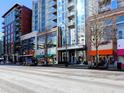 Street view of a modern building, showcasing nearby shops and restaurants, with easy access at 855 Peachtree St # 2205, Atlanta, GA 30308
