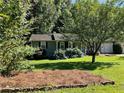 House exterior showcasing landscaping and pine straw at 2832 Jordan Forest Nw Trl, Lawrenceville, GA 30044