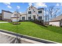 Exterior view of a two-story house with a stone and white facade at 2023 Fern Mountain Ln, Marietta, GA 30064