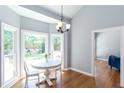 Bright breakfast nook with hardwood floors and view of backyard at 4083 Brookside Manor Dr, Tucker, GA 30084