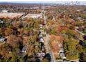 Aerial view showcasing the neighborhood's autumn foliage and city skyline at 921 Byron Sw Dr, Atlanta, GA 30310