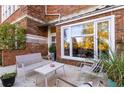 Relaxing outdoor patio space with seating and views of the surrounding greenery at 978 North Ne Ave # 107, Atlanta, GA 30306