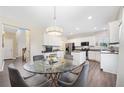 Open concept kitchen with breakfast nook and view into living room at 1107 Silverbrooke Dr, Powder Springs, GA 30127