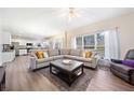 Spacious living room featuring a sectional sofa, coffee table, and fireplace at 1107 Silverbrooke Dr, Powder Springs, GA 30127