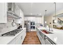 Modern kitchen featuring white cabinets, stainless steel appliances, and an island at 1927 Streamlet Xing, Kennesaw, GA 30152