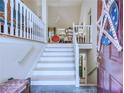 View of the interior staircase with stylish decor and high ceilings at 27 Danbury Hill # Coweta, Sharpsburg, GA 30277