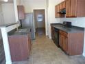 Modern kitchen with stainless steel appliances and tile flooring at 52 Providence Oak Ct, Lawrenceville, GA 30046