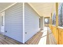 Clean lines define this home's exterior, complemented by a welcoming porch at 727 Copper Trace Way, Woodstock, GA 30189