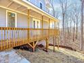 A charming porch with wooden railing offers an inviting outdoor space at 727 Copper Trace Way, Woodstock, GA 30189