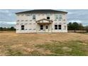 House under construction, showcasing its two-story design and large windows at 3121 Morris Hills Dr, Dacula, GA 30019