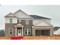 Two-story house with brick and siding exterior, and a two-car garage at 3121 Morris Hills Dr, Dacula, GA 30019