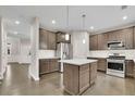 Beautiful kitchen with granite countertops, stainless steel appliances, and a stylish center island at 147 Stargaze Rdg, Canton, GA 30114