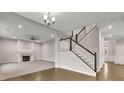 Bright living room with a fireplace and staircase at 147 Stargaze Rdg, Canton, GA 30114