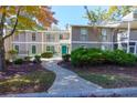 Inviting townhouse with a well-manicured lawn and a paved walkway at 811 Wynnes Ridge Se Cir, Marietta, GA 30067