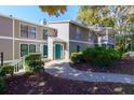 Townhouse exterior with green door and walkway at 811 Wynnes Ridge Se Cir, Marietta, GA 30067