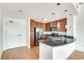 Bright kitchen features wood cabinets, granite countertops, stainless steel appliances and a large island for extra counter space at 563 Memorial Se Dr # 503, Atlanta, GA 30312