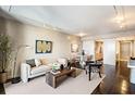 Open living room with hardwood floors, large windows, and modern furniture at 75 14Th St # 3640, Atlanta, GA 30309