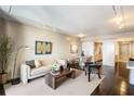 Open-concept living room with contemporary design elements, dining area, and access to other parts of the home at 75 14Th St # 3640, Atlanta, GA 30309