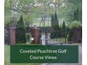 The gated entrance to a home with views of the Peachtree Golf Course in the background at 3368 Ashford Dunwoody Rd, Atlanta, GA 30319