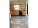 Functional kitchen with wood cabinets, granite countertops, and modern appliances at 1255 Silverstone Trl, Jonesboro, GA 30238