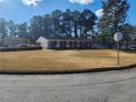Ranch style home with carport and well-manicured lawn at 4129 Pepperdine Dr, Decatur, GA 30034